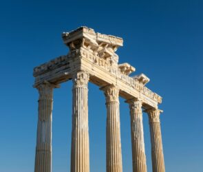 a tall stone structure with four pillars