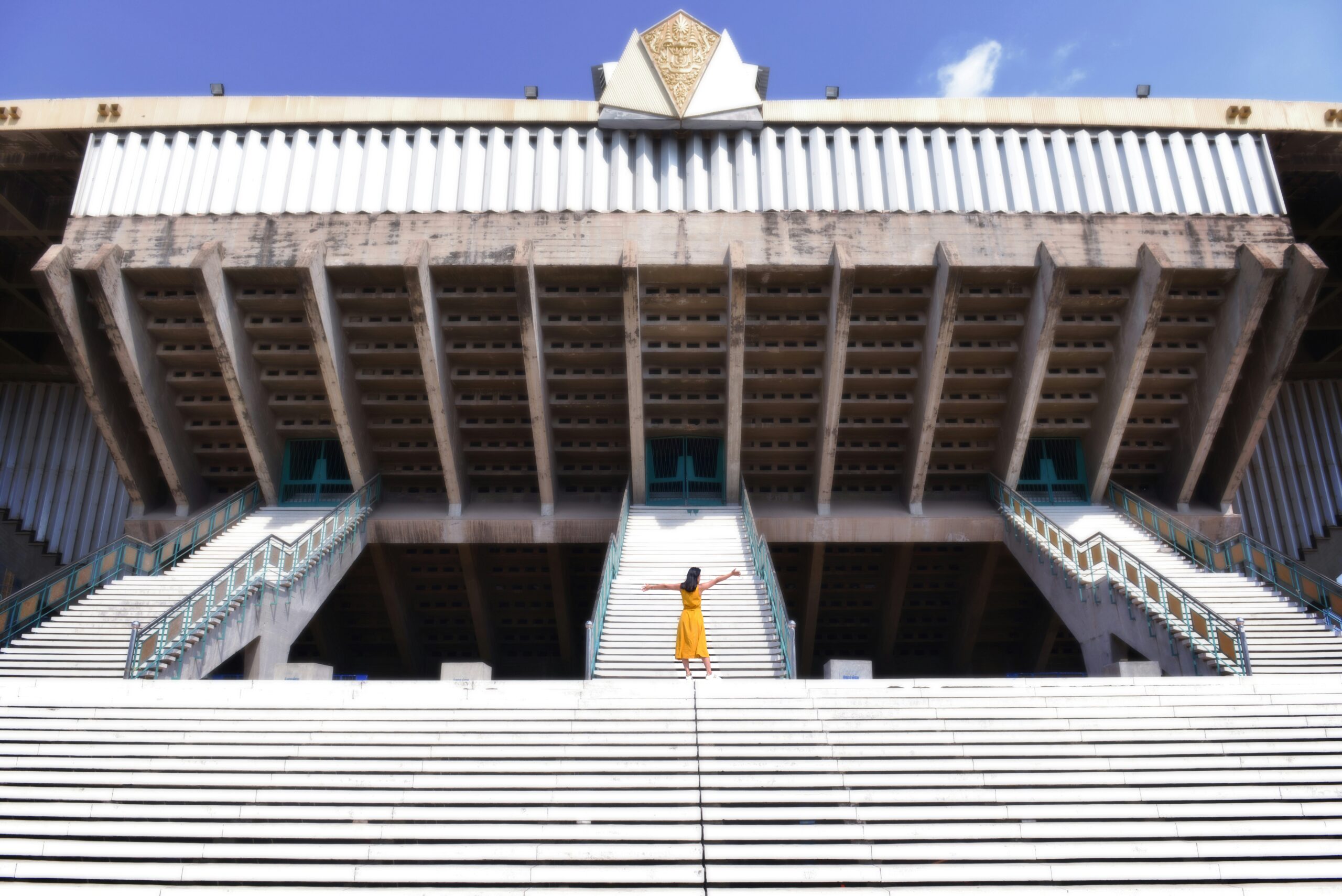 people walking on white concrete stairs during daytime